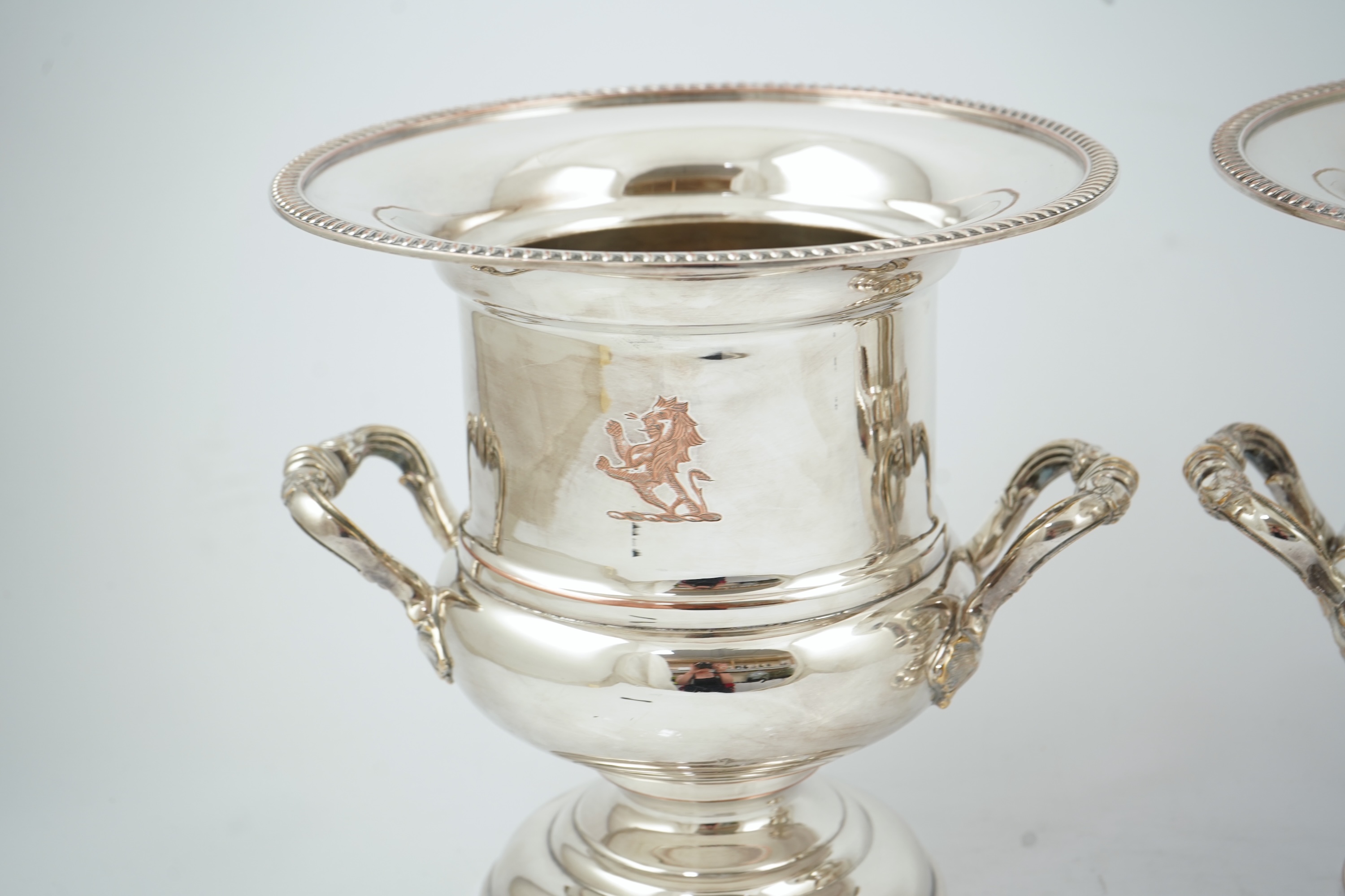 A pair of late 19th/early 20th century silver plated two handled campana shaped wine coolers, makers, FH